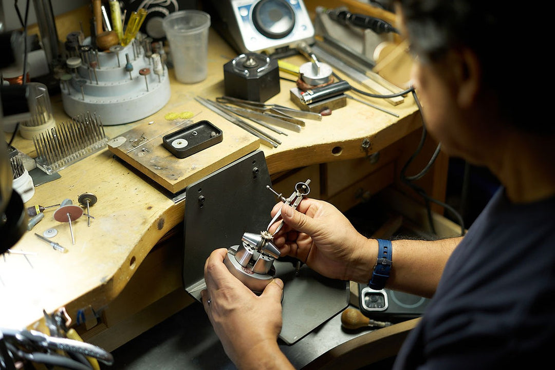 Jeweler working by hand at the bench inside Couture Jewelry Atelier in New York City