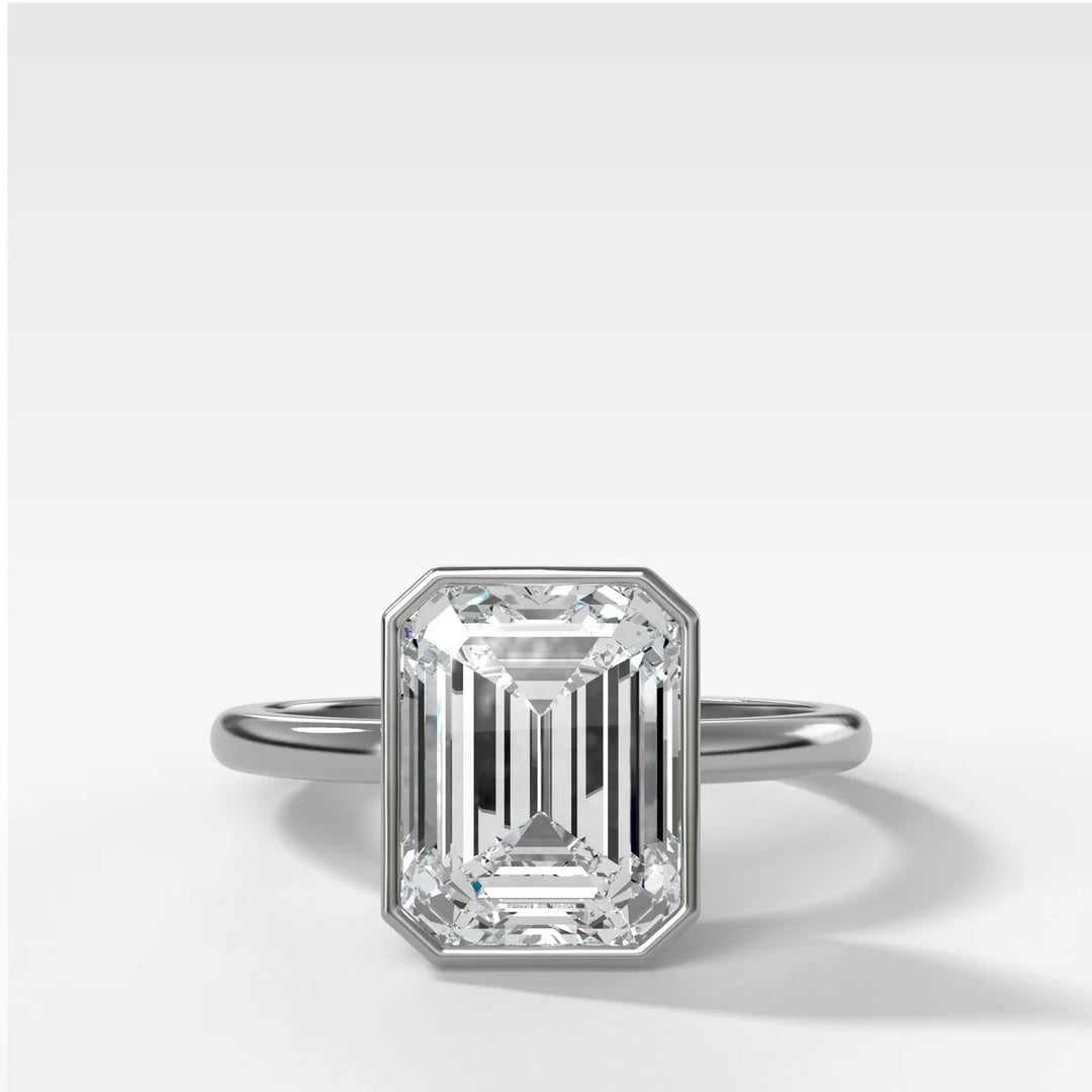 14k white gold bezel set emerald cut diamond engagement ring, modern minimalist design with 2.50ct lab stone