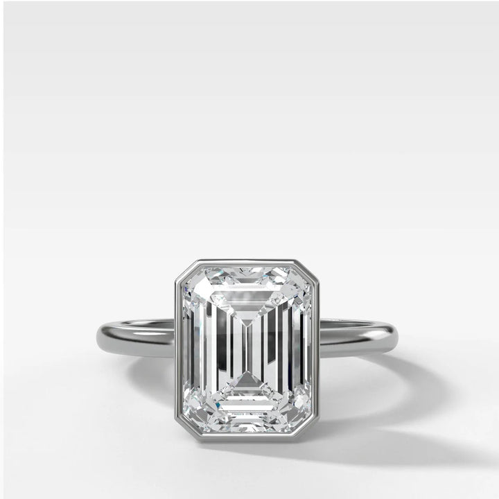 14k white gold bezel set emerald cut diamond engagement ring, modern minimalist design with 2.50ct lab stone