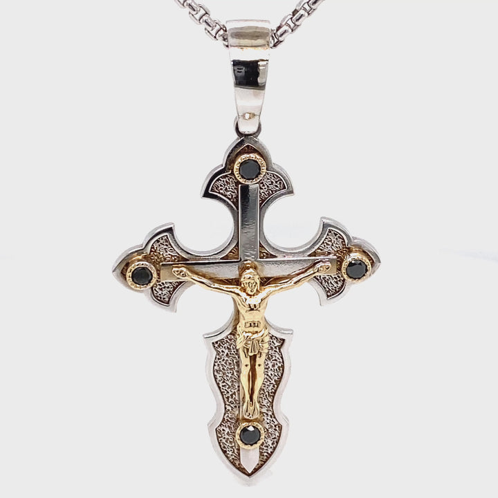 Side view of 14K two-tone gold crucifix cross pendant with black diamond accents