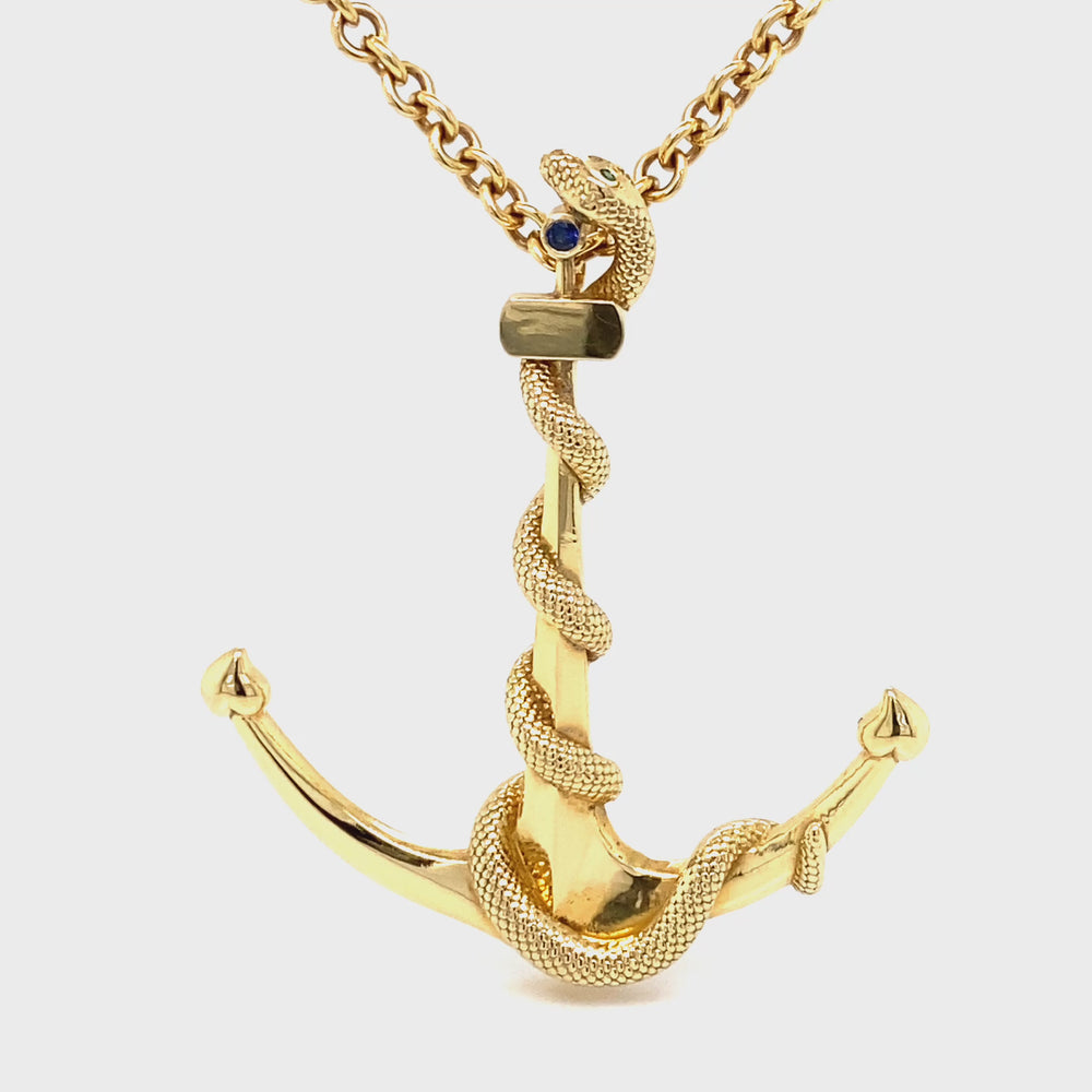 Solid 18K yellow gold anchor pendant with snake design and gemstone accents