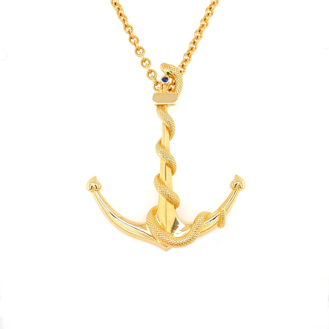 18K yellow gold anchor snake pendant necklace with emeralds and sapphire on 24 inch gold cable chain
