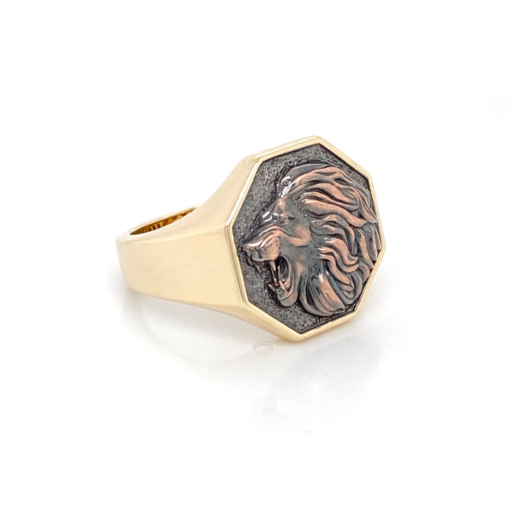 Two-tone 14K gold lion signet ring with black oxidized rose gold lion face